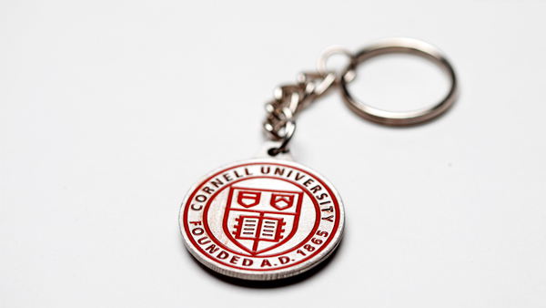 Silver keychain with red insignia