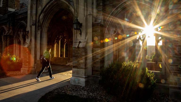 Student entering the War Memorial before sunset.